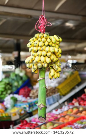 Bunch of small yellow bananas for sale in Spice souk, Dubai, United Arab Emirates