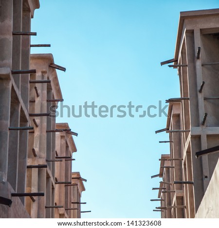 Arabian Wind Towers on the top of a house in Dubai, United Arab Emirates. Wind Towers were used in the arab architecture to cool the buildings.