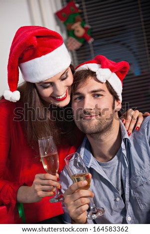 Young couple using drinking champagne on new year\'s eve