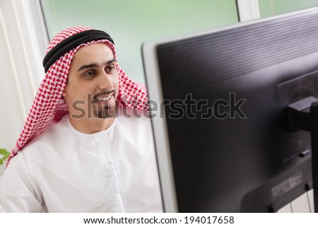 Portrait of Arab businessman working in office