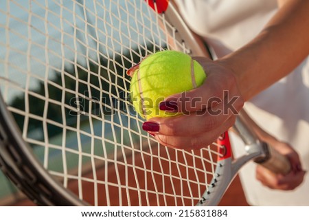Player\'s Hands With Tennis Racket And Tennis Ball. Ready To Serve
