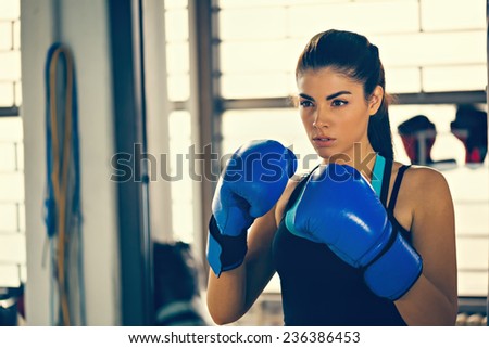 Attractive Female Boxer At Training