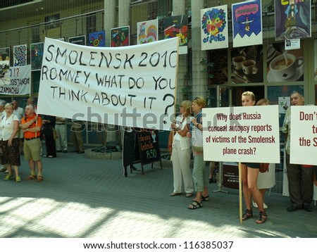 WARSAW - JULY 31: crowd challenges Mitt Romney to take stand on Russian investigation of Smolensk 2010 presidential plane crash, during his Warsaw visit on July 31, 2012 in Warsaw, Poland