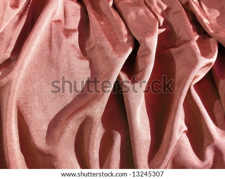 Creased red, pink satin fabric. Ideal for Christmas, bedroom, bed sheet, bed linens, bed cover, fashion, abstract, valentines, sexy textile background design. More textiles and background in my port.