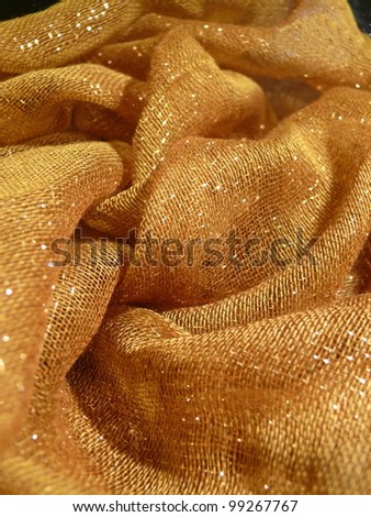 Beautiful, subtle, golden, fashionable oriental scarf textile texture. Good for fashion, oriental, apparel, abstract, conceptual designs.