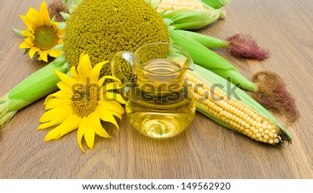 sunflowers, corn and oil in a glass jar close-up. horizontal photo.