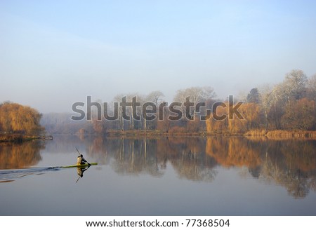 autumn landscape river in the morning, autumn. person moves in a kayak