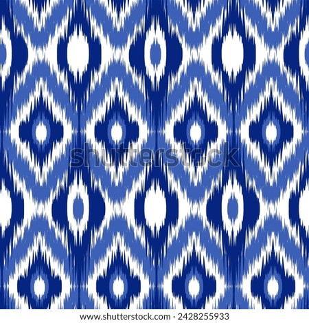 Seamless pattern Tribal Art Ikat Ogee in traditional classic blue and white colors. Boho style. Indian indigo