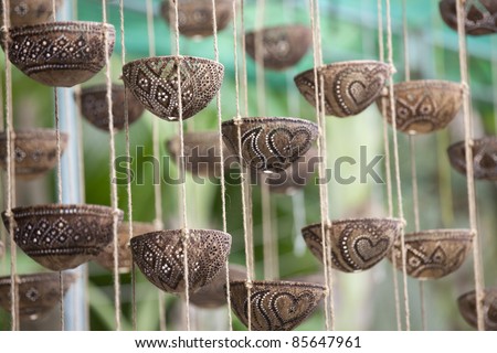 These Crafts engraving from the coconut shell in Damnoen Saduak Floating Market, Thailand.