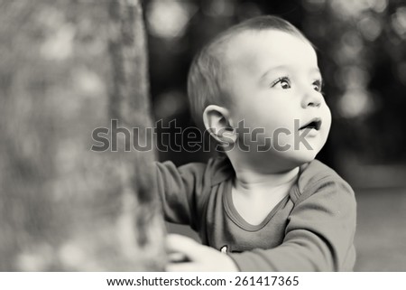 portrait of a curios little boy in the nature - black and white