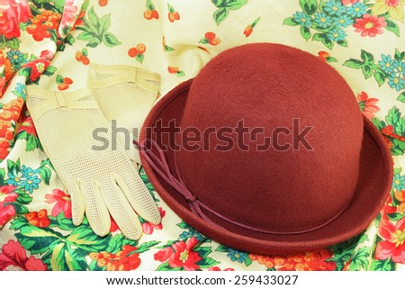 Vintage red hat and gloves on headscarf