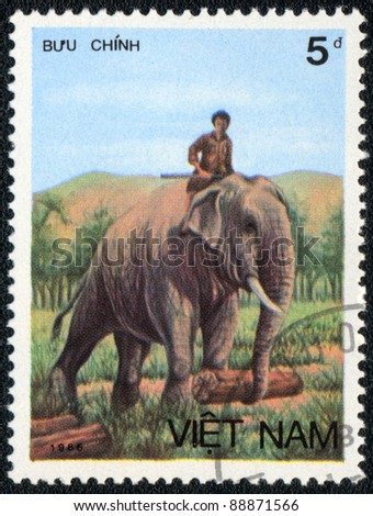 VIETNAM - CIRCA 1986: A stamp printed in VIETNAM shows worker  elephant, Asian elephant series, circa 1986