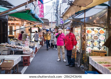 Tokyo, Japan - March 03, 2015: Famous Tsukiji fish market shops. Tsukiji is the biggest fish market in the world, with a vast varaiety of Fish and Sea food
