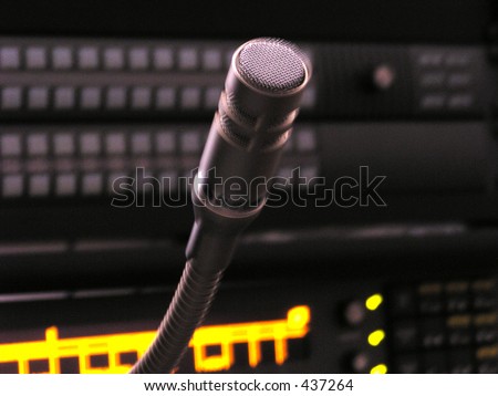 Digital communication system lit up with close up of microphone