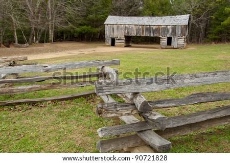 Rustic wooden barn and split rail fence