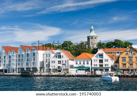 STAVANGER, NORWAY - AUGUST 10: Guest harbour with old-style houses on August 10, 2013 in Stavanger, Norway. View from the sea