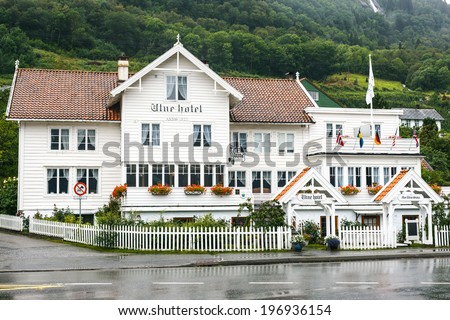 UTNE, NORWAY - AUGUST 16: Old white wooden hotel in Utne, Norway, on August 10, 2013. Utne Hotel is one of NorwayÃ¢Â?Â?s oldest hotels in continuous operation in the same building