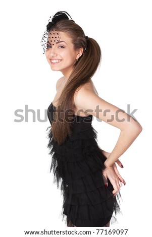 Portrait of young female in black cocktail dress and the hat with veil isolated on white background