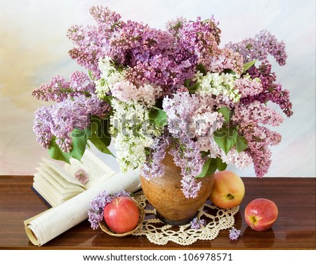 Teacher Day still life with huge lilac flowers bunch in vase,open book,map and apples.