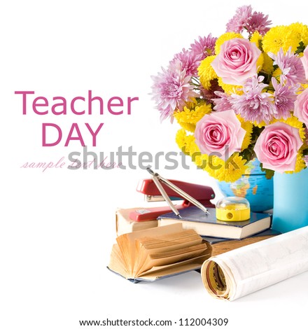 Teacher Day (still life with autumn flowers and roses, book, map and sharpener isolated on white with sample text)