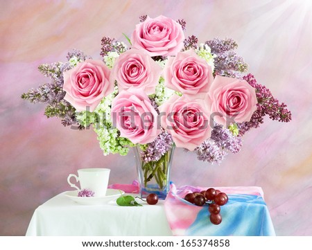 Still life with lilac and roses flowers bunch on artistic background