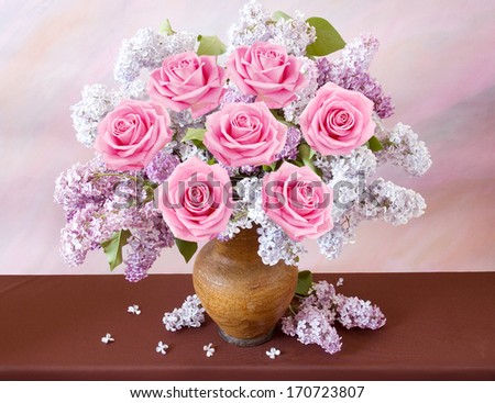Still life with huge bunch of roses, lilac flowers  on painting background