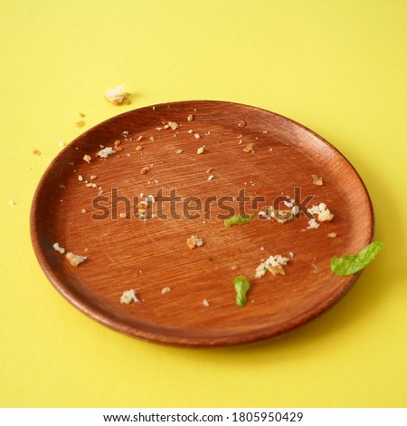 breadcrumbs on empty plate on yellow background, flat lay ストックフォト © 