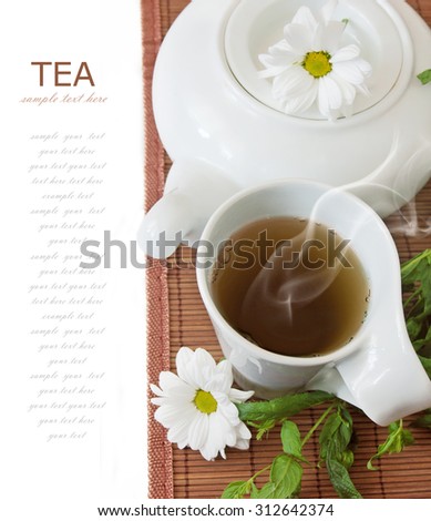 Chamomile tea breakfast (still life with tea cup and fresh green leaves isolated on white background with sample text)
