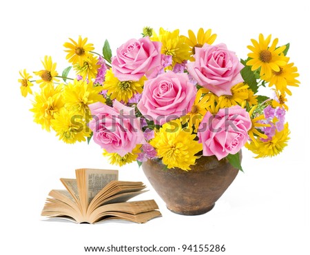 Teacher day (rich bouquet with summer flowers and pink roses and old book isolated on white)