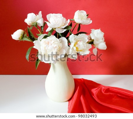 Huge bunch of white peonies on artistic background