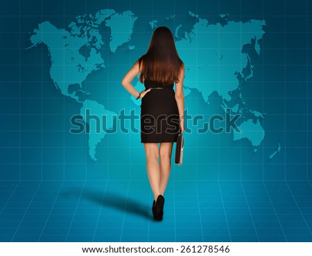 The girl goes to a world map on blue background.