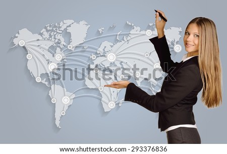 Young girl holding a pen standing on world map background.