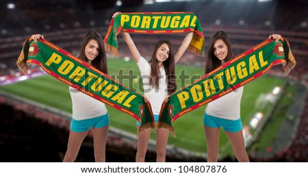 soccer fan with the stadium on the back with a portuguese scarf