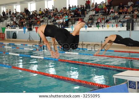 swimming competition - inside pool - jump to start