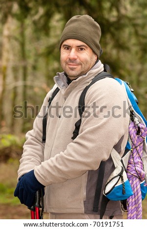 hiker looking on front of him with backpack and gear