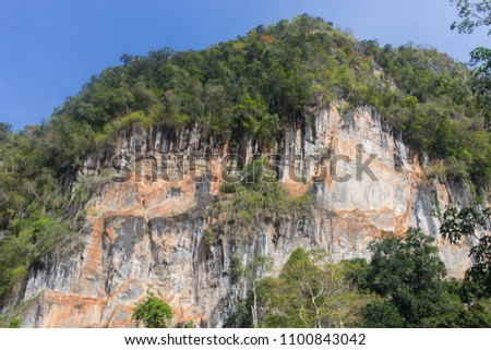 Mountain of Tham Le Stegodon Cave. The sea cave in the N-S elongated cliff limestone mountain ranges located in Satun, Thailand. Foto stock © 