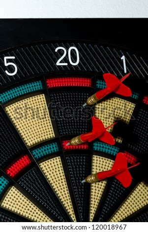 Close up of an electronic dart board and red arrow