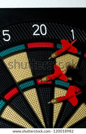 Close up of an electronic dart board and red arrow