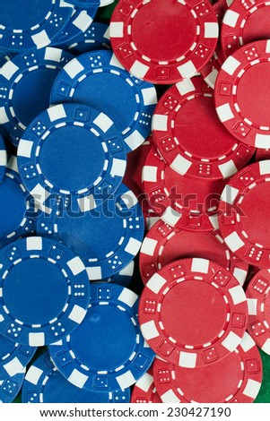 Battle Blue versus red yin vs yang Playing Poker Chips in green background