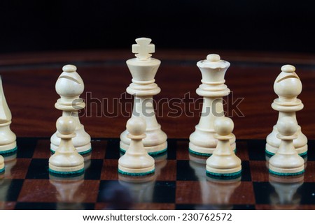 Closeup white king and queen Set of chess figures on the playing board