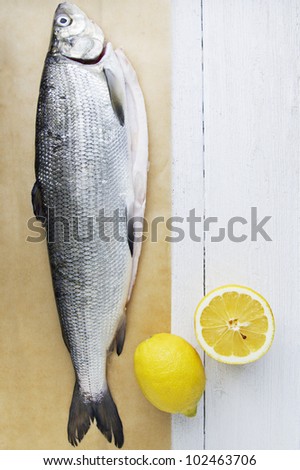Fresh Fish on Wooden Background. Space for Text or Recipe.