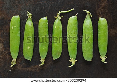 Fresh picked organic garden peas in pods.