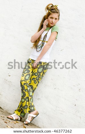 Teenage fashion girl showing off clothes and jewelry
