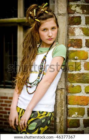 Teenage fashion girl showing off clothes and jewelry