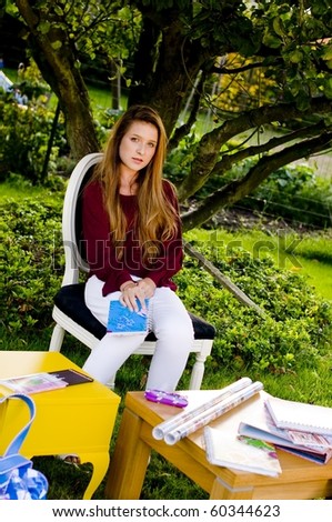 Back to school fashion girl showing bags, class book and accessories