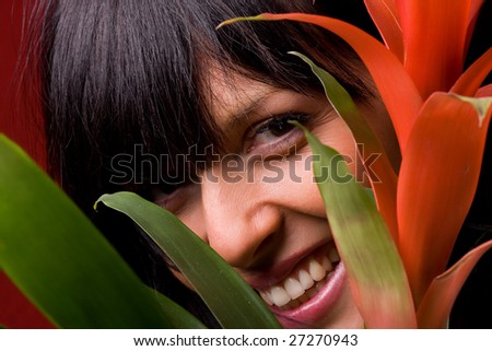 Portrait of beautiful smiling girl with orange flowers