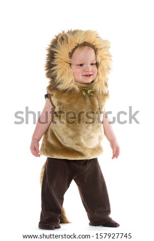 18-month-old baby boy in a lion costume for Halloween on white background