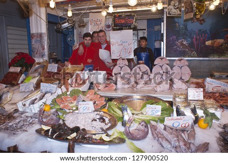 PALERMO - DECEMBER 22: men selling fish on the local market in Palermo, called Ballaro. This market is also tourist attraction in Palermo, Sicily, Italy on Dec. 22, 2012.