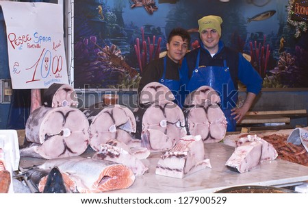 PALERMO - DECEMBER 22: men selling swordfish on the local market in Palermo, called Ballaro. This market is also tourist attraction in Palermo, Sicily, Italy on Dec. 22, 2012.