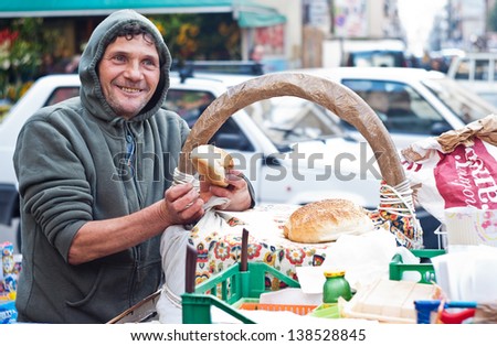 PALERMO - DECEMBER 29: Man sells Frittola on the local market in Palermo, called Ballaro. This market is also tourist attraction in Palermo, Sicily, Italy on Dec. 29, 2012.
